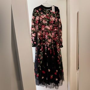 A beautiful never worn floral modest ball gown..